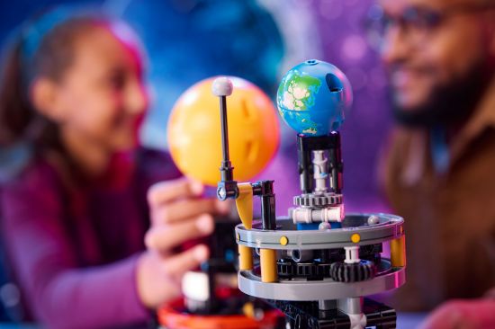 playing LEGO Technic 42179 Planet Earth and Moon in Orbit