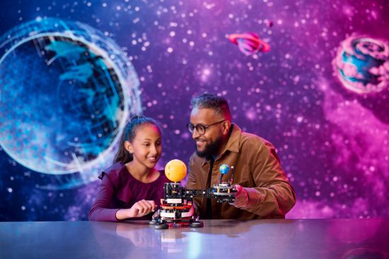 playing LEGO Technic 42179 Planet Earth and Moon in Orbit