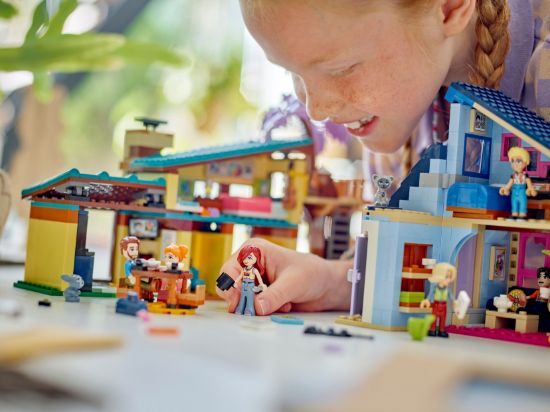 playing LEGO Friends 42620 Olly and Paisley's Family Houses