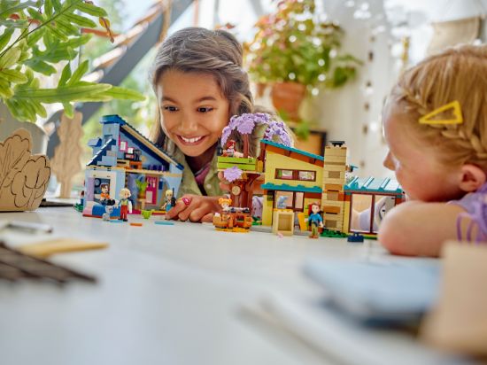 playing LEGO Friends 42620 Olly and Paisley's Family Houses