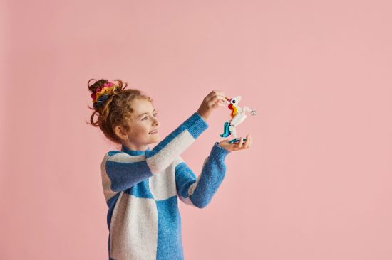 playing LEGO Creator 31140 Magical Unicorn