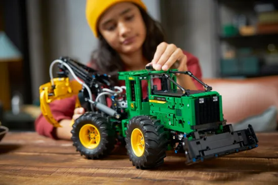 playing LEGO Technic 42157 John Deere 948L-II Skidder