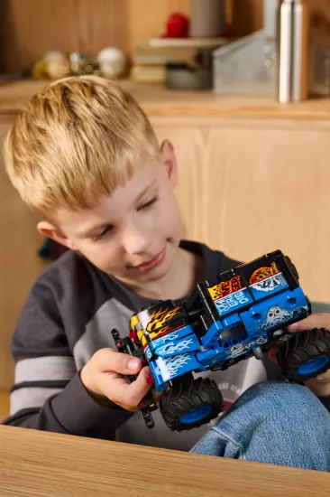 playing LEGO Technic 42219 Monster Jam™ Grave Digger™ Fire and Ice Vehicle