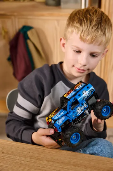 playing LEGO Technic 42219 Monster Jam™ Grave Digger™ Fire and Ice Vehicle