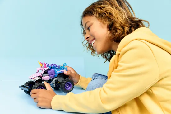 playing LEGO Technic 42220 Monster Jam™ Sparkle Smash™ Pull-Back Vehicle