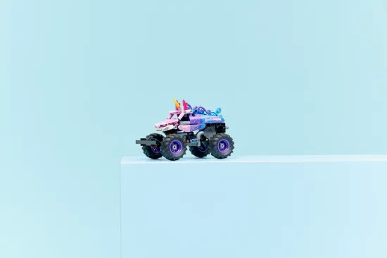playing LEGO Technic 42220 Monster Jam™ Sparkle Smash™ Pull-Back Vehicle