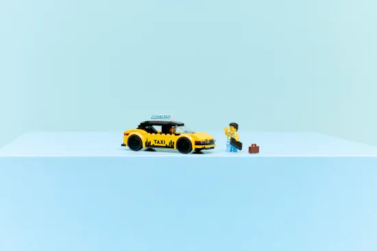 playing LEGO City 60487 Yellow Taxi Vehicle