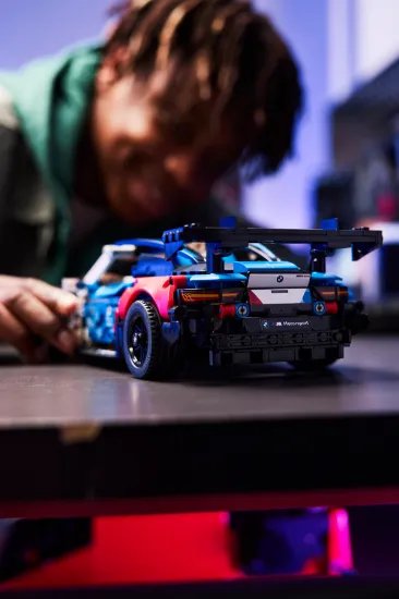 playing LEGO Technic 42226 BMW M4 GT3 EVO Race Car Vehicle