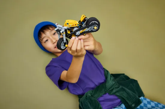 playing LEGO Technic 42225 Yellow Motorcycle Vehicle
