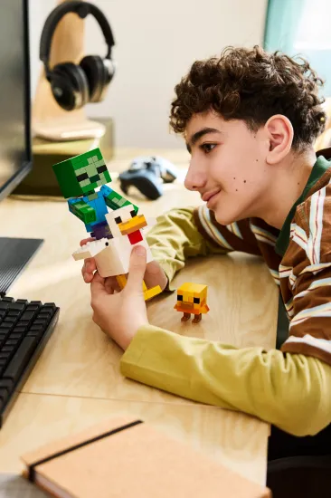 playing LEGO Minecraft 21582 Chicken Jockey