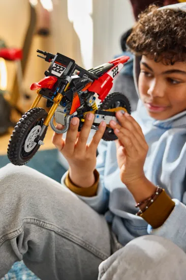 playing LEGO Technic 42238 Ducati Desmo450 MX Factory Motorcycle