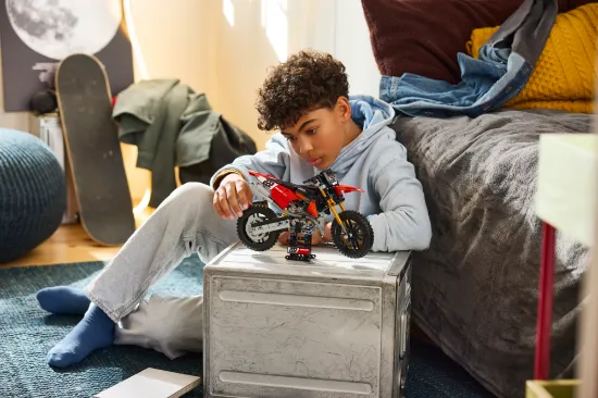 playing LEGO Technic 42238 Ducati Desmo450 MX Factory Motorcycle